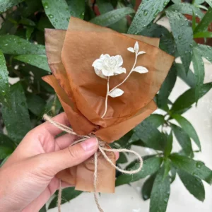 A delicate 925 sterling silver mini Gardenia Bouquet wrapped in rustic brown paper with twine, handmade by Lazesoul. Perfect as timeless Art Gifts, blending nature-inspired elegance with artisanal craftsmanship.
