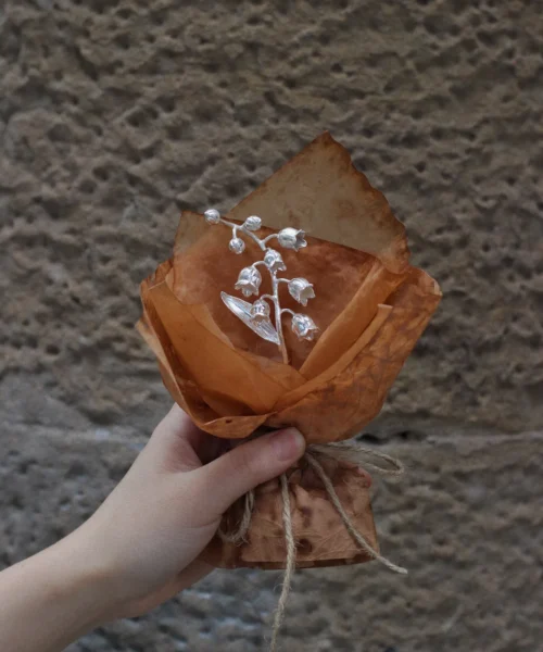 Handcrafted 925 sterling silver mini Lily of the Valley bouquet wrapped in rustic brown paper with twine, by Lazesoul Handmade Art Gifts. Elegant art gift capturing delicate bell-shaped blooms in timeless metallic detail.