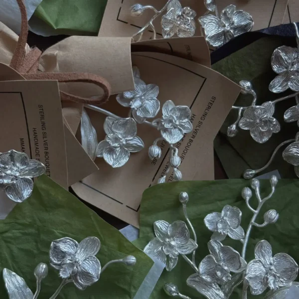 Handcrafted 925 sterling silver Phalaenopsis Mini Bouquet hairpiece by Lazesoul. Elegant floral design with intricate petals, perfect for weddings, art gifts, and collectors seeking timeless handmade silver jewelry.