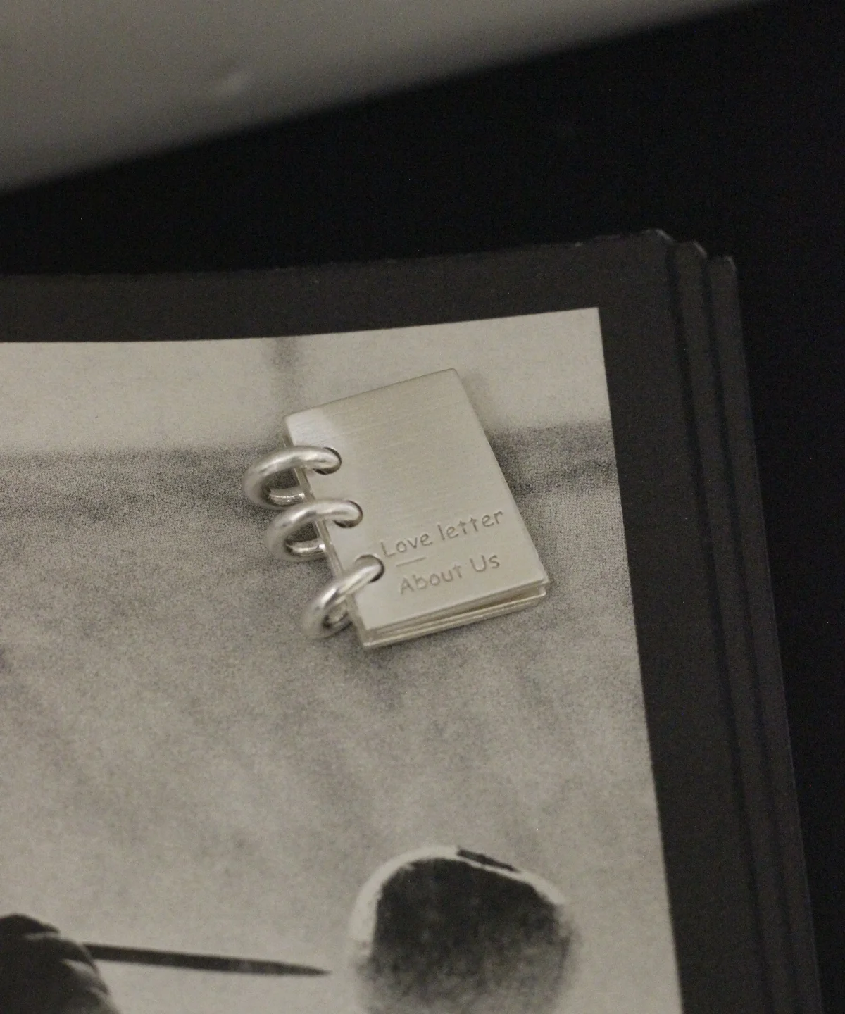 Lazesoul handmade 925 sterling silver book necklace featuring a miniature notebook‑style pendant engraved “Love Letter About Us,” with three binder rings, crafted as personalized custom jewelry for romantic keepsakes and meaningful gifts.