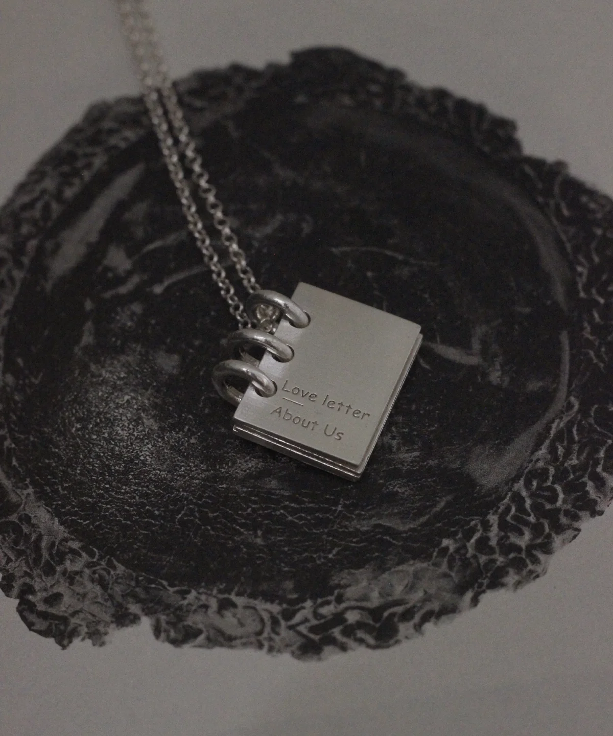 A romantic 925 sterling silver book necklace by Lazesoul, handmade with a miniature book pendant engraved “Love Letter About Us,” featuring binder‑style rings and a personalized design, perfect as custom jewelry for meaningful gifts.