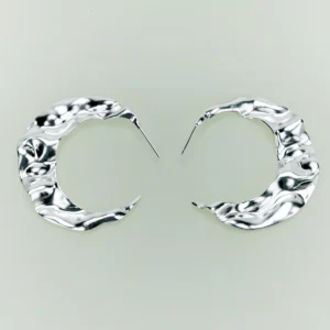 Handcrafted Moon Aria 990 pure silver sculptural moon earrings by Lazesoul, featuring fluid crescent shapes with a textured, wavy surface. Elegant handmade art jewelry for lovers of unique, modern moon earrings.