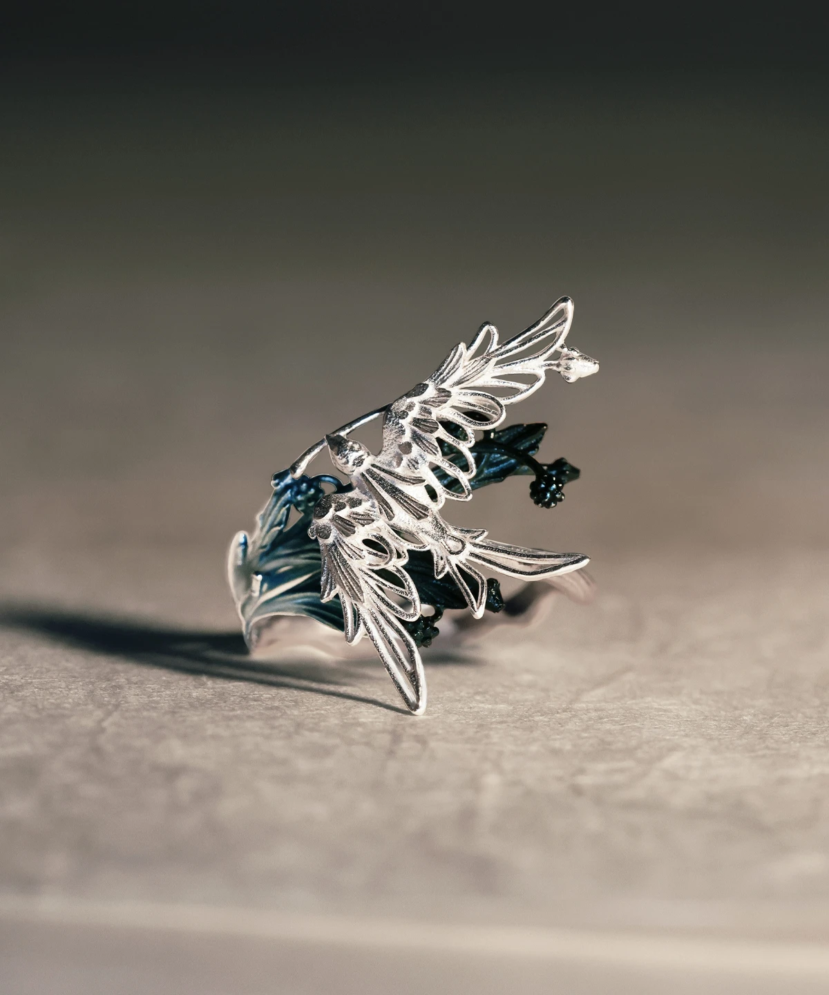 A handmade 925 sterling silver open adjustable statement ring featuring a design of stray birds gliding over tree branches, with intricate feather details and artisan craftsmanship by Lazesoul.