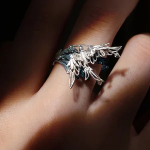 Close-up of Lazesoul handmade jewelry: Stray Birds 925 sterling silver open adjustable statement ring. Intricate feathered wing design with dark band, nature-inspired craftsmanship, elegant bold statement ring for women and men.
