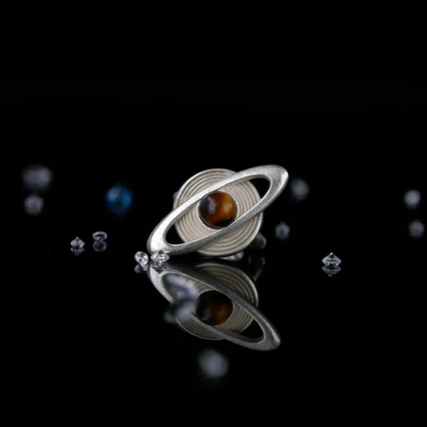 Lazesoul handmade Saturn Earrings in 925 sterling silver with polished tiger’s eye gemstones, designed with orbit-inspired bands that echo Saturn’s rings; celestial artisan jewelry blending cosmic elegance, astronomy symbolism, and timeless craftsmanship.