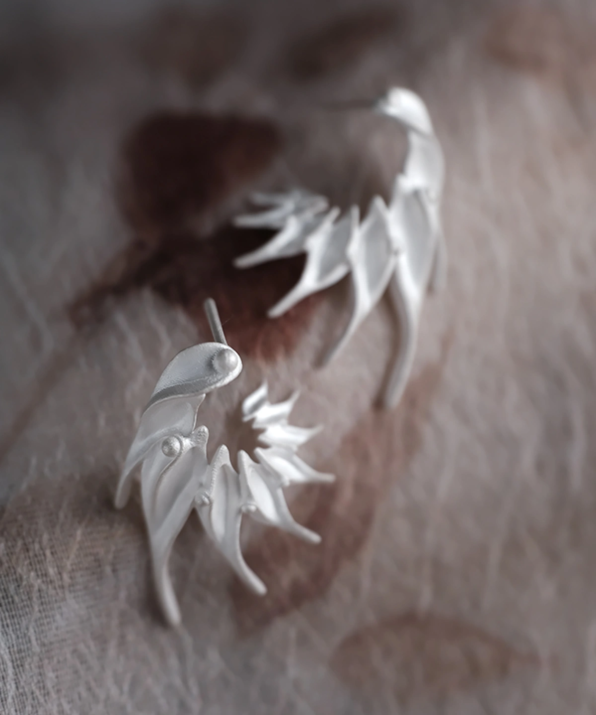 Ethereal Wings S925 Sterling Silver Designer Earrings by Lazesoul. Handmade art jewelry with feather‑like curves and sculptural organic forms. Unique designer earrings crafted with elegance, artistry, and timeless sophistication for modern style.