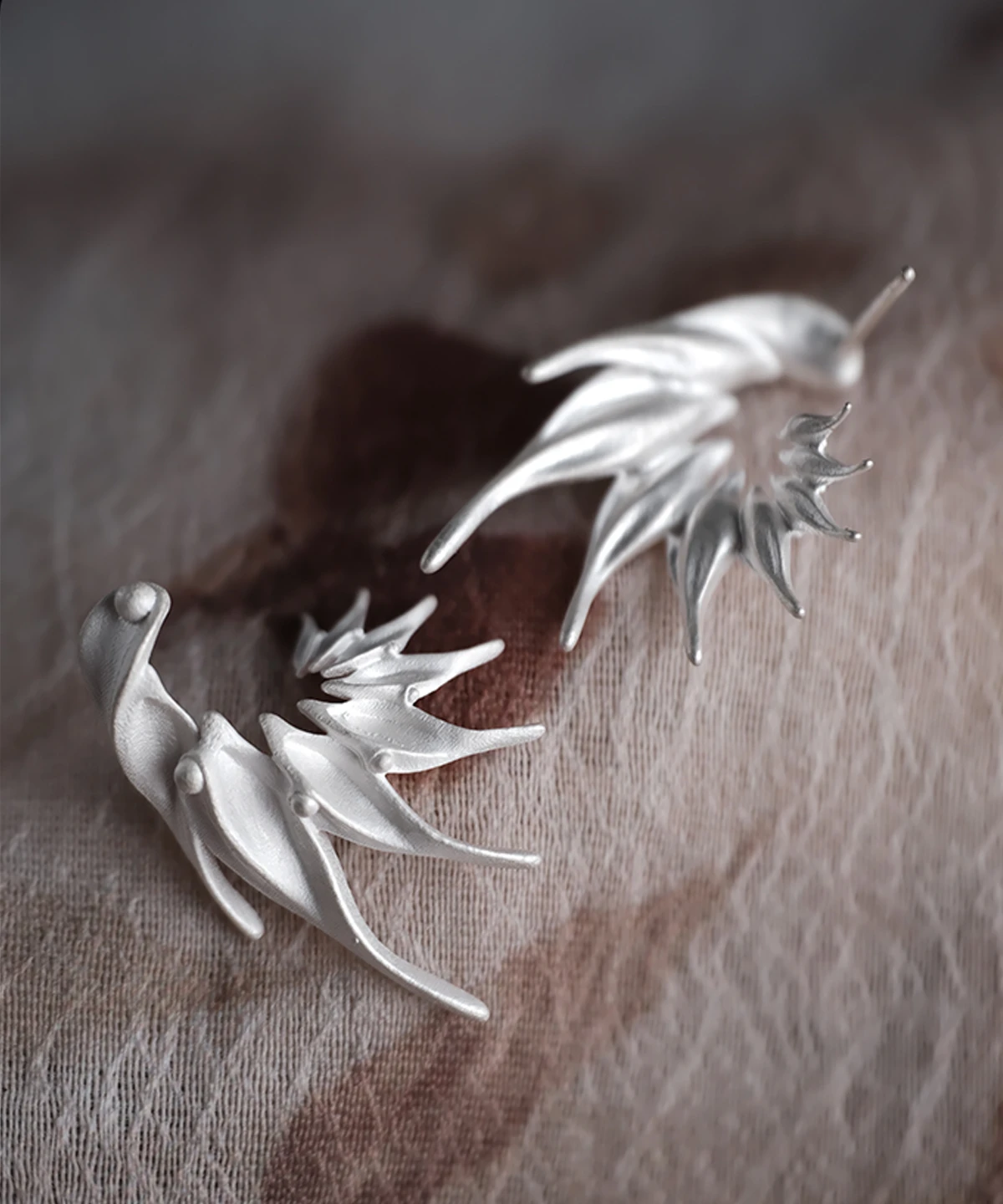 Ethereal Wings S925 Sterling Silver Designer Earrings by Lazesoul. Handmade art jewelry with flowing, wing‑inspired curves, sculptural organic forms, and polished accents. Unique designer earrings for modern elegance and timeless style.
