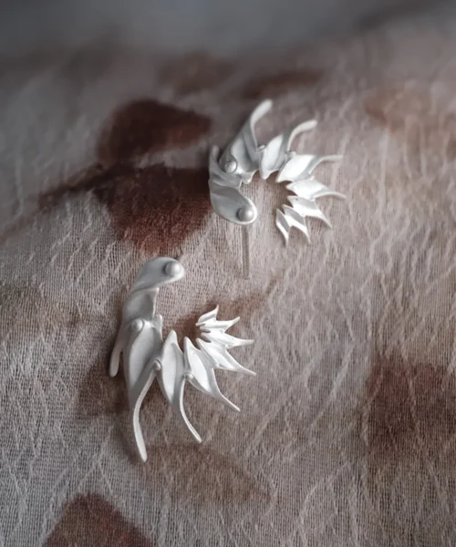 Ethereal Wings S925 Sterling Silver Designer Earrings by Lazesoul. Handmade art jewelry with sculptural, wing‑inspired shapes, organic floral curves, and artisan craftsmanship. Unique designer earrings for elegant, timeless style.