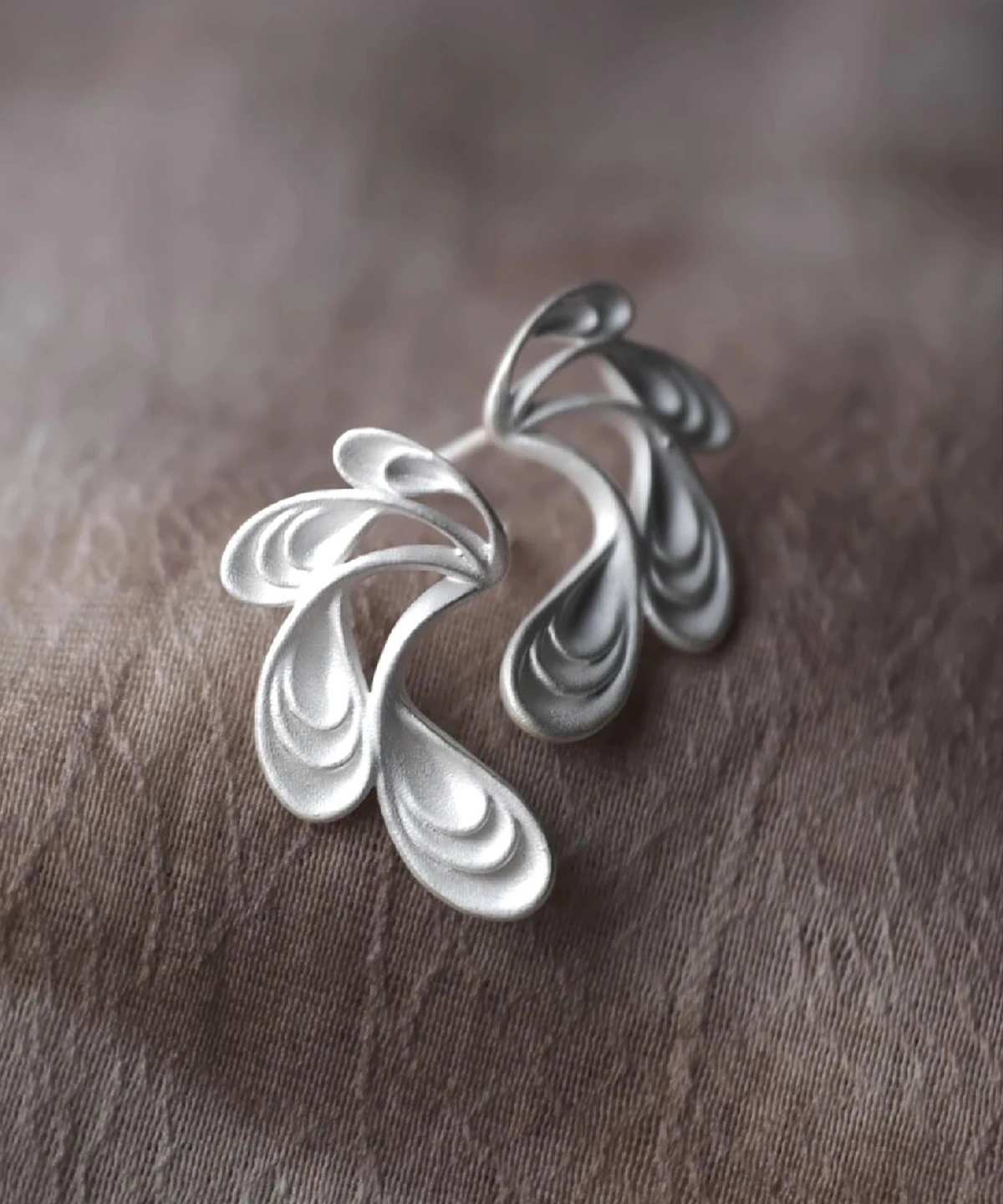 Sylph Dancer S925 Sterling Silver Fantasy Handmade Earrings by Lazesoul. Fluid, petal‑like design with matte finish and subtle ridges, handcrafted artistry that blends elegance, fantasy, and nature‑inspired jewelry design.