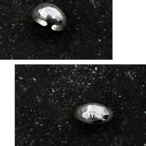 Two views of a silver ring with hammered texture and a star-shaped engraving featuring a lab grown diamond, styled on a dark surface to highlight the April Birthstone Ring’s craftsmanship.