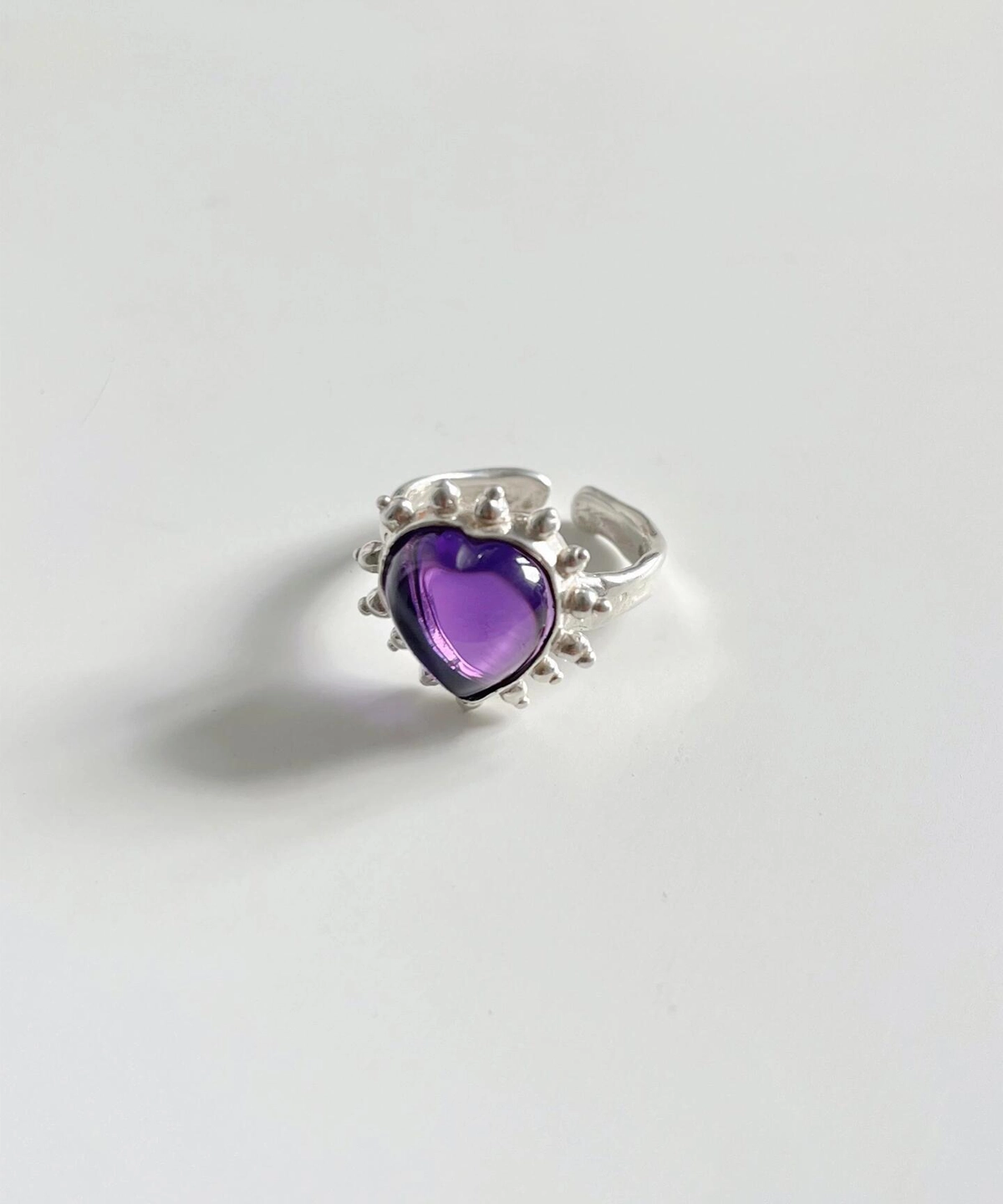 February Birthstone Ring-Natural Amethyst Ring in Sterling Silver 09 Silver ring with heart-shaped natural amethyst gemstone surrounded by beaded detailing, showcasing the February Birthstone Ring in sterling silver on a white background.