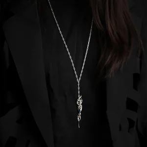 Close-up of Lazesoul Handmade S925 Sterling Silver Spiral Pendant Necklace worn with black shirt and jacket. The spiral pendant features a twisted silver design with a vivid blue gemstone, standing out against dark clothing. Elegant spiral necklace craftsmanship.