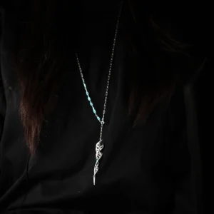 Close-up of Lazesoul Handmade S925 Sterling Silver Spiral Pendant Necklace worn with a black shirt. The spiral pendant features interwoven silver loops in a twisted design, accented with fantasy-inspired curves, hanging low on the chest. Elegant spiral necklace craftsmanship.