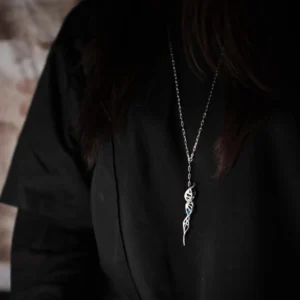 Close-up of Lazesoul Handmade S925 Sterling Silver Spiral Pendant Necklace worn with a black shirt. The spiral pendant features a DNA-inspired double helix silver design, hanging centrally on the chest, highlighting the elegant craftsmanship of this spiral necklace.