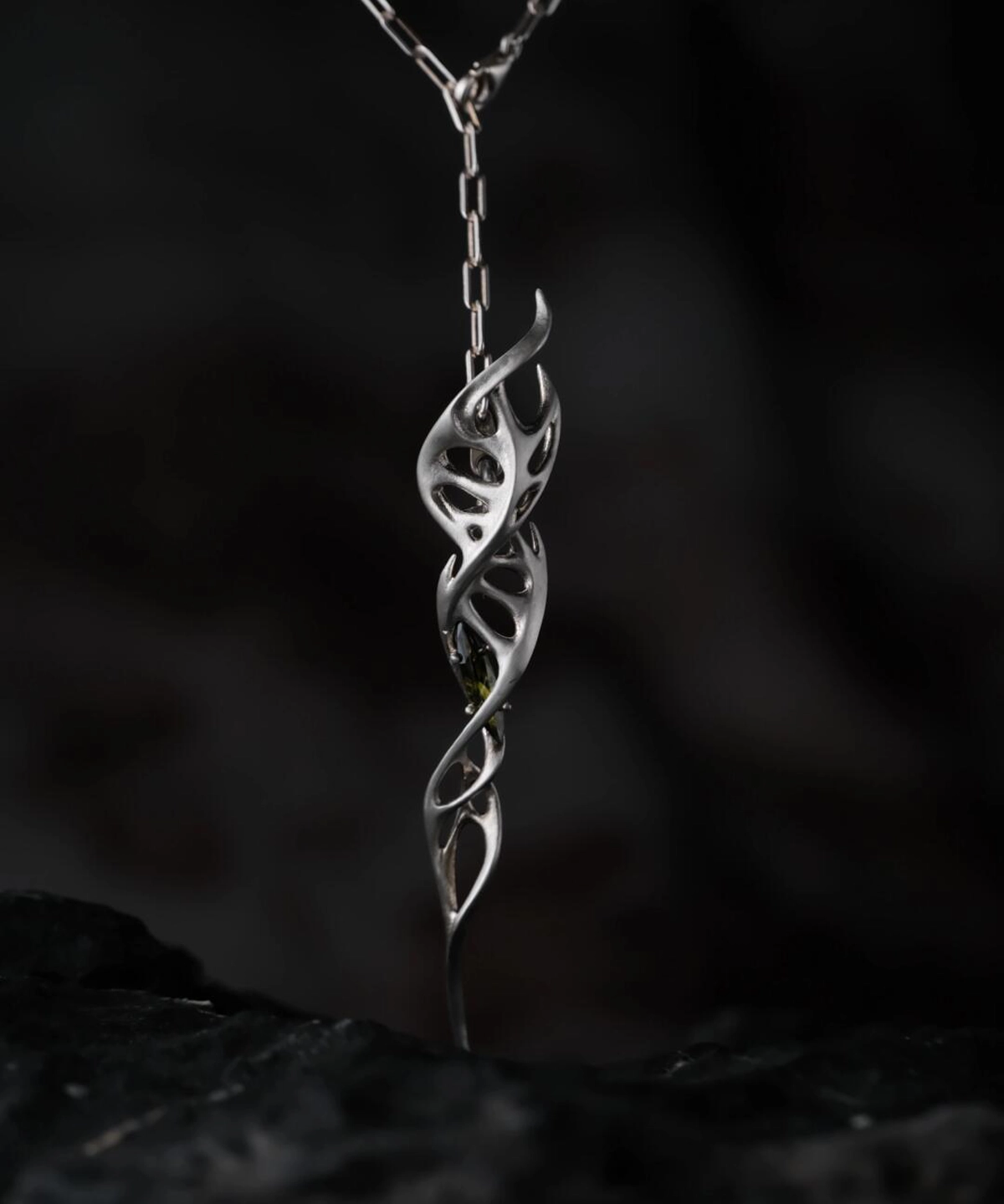 Close-up of Lazesoul Handmade S925 Sterling Silver Spiral Pendant Necklace worn with a black shirt. The spiral pendant features an intricate double helix silver design, hanging centrally on the chest, highlighting the elegant craftsmanship of this spiral necklace.