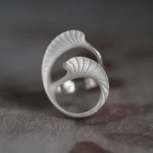 Arc Glow S925 Sterling Silver Ring with intertwined leaf-like design and matte textured surface; a nature-inspired Unique Ring featuring fine vein-like details and sculptural symmetry, styled in close-up view.
