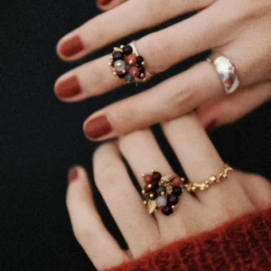 925 Sterling Silver Ring with multicolored Natural Stone beads in black, red, purple, and gold, worn on hands with dark red nails and paired with textured silver and gold bands; a handcrafted Natural Stone Ring with botanical charm.