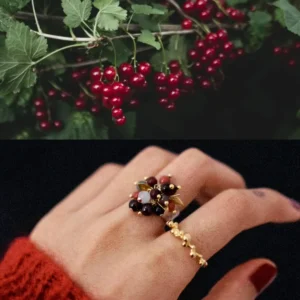 925 Sterling Silver Ring with multicolored Natural Stone beads in red, black, orange, and white, accented with golden leaves and spheres; a handcrafted Silver Ring worn on hand, paired with red currants above for nature-inspired styling.