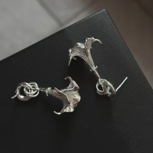 S925 Sterling Silver Flower Earrings with trumpet-shaped floral design and twisted knot detail; handcrafted Silver Earrings featuring botanical textures and sculptural elegance, styled on black background.