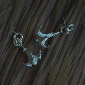 Datura-Handcrafted S925 Sterling Silver Flower Earrings 09 S925 Sterling Silver Datura Flower Earrings with trumpet-shaped bloom and looped stud design; handcrafted Silver Earrings styled on wood surface, showcasing botanical elegance and intricate metalwork.