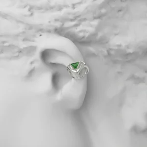 Dreamscape Garden S925 Silver Ear Cuff with green triangular gemstone and sculptural silver framework, styled on a matte ear model; a modern Silver Ear Cuff blending geometric elegance and botanical inspiration.