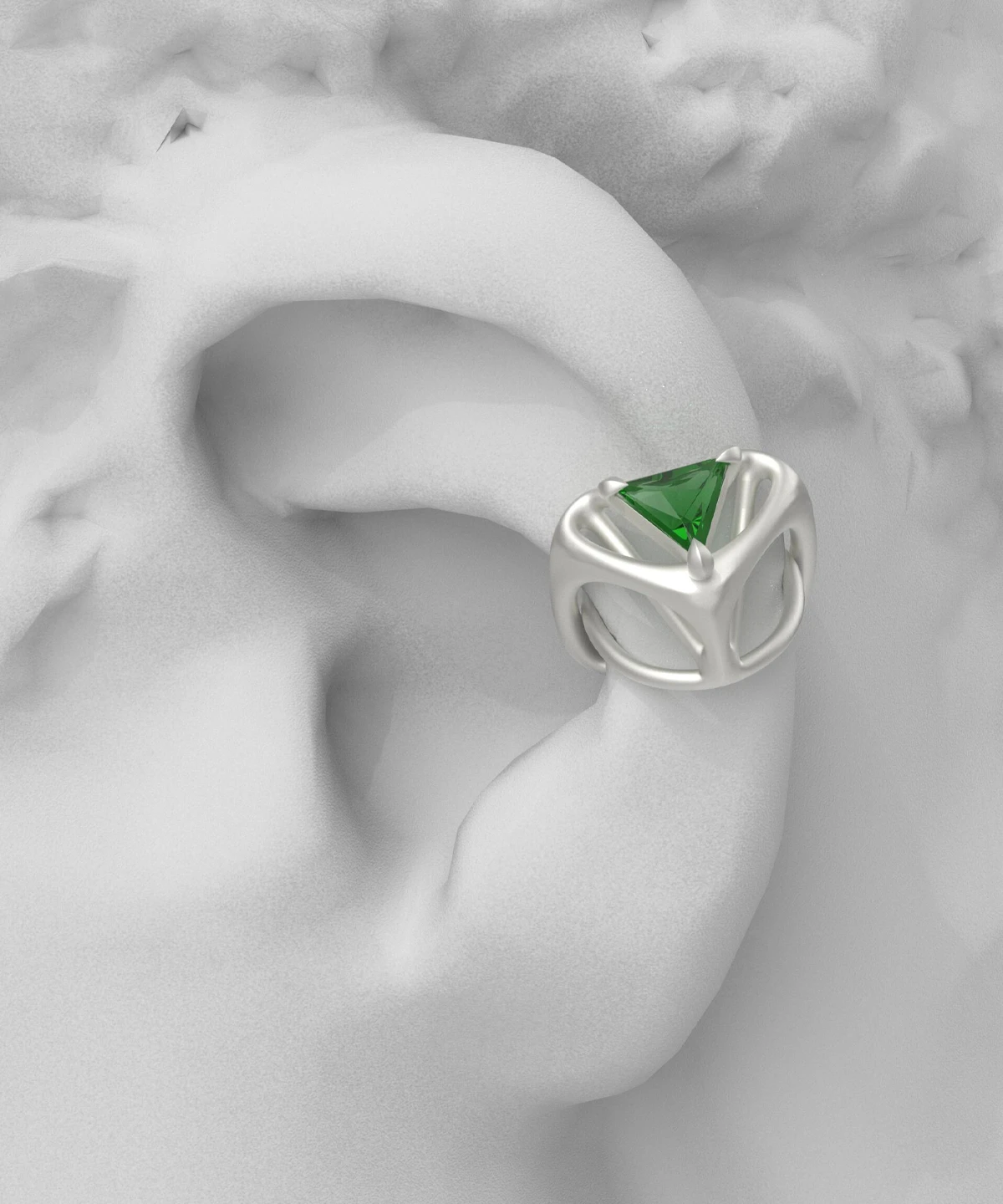Dreamscape Garden S925 Silver Ear Cuff with green triangular gemstone and sculptural silver framework, styled on a matte ear sculpture; a modern Silver Ear Cuff blending botanical elegance and geometric artistry.