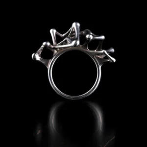Leaping Orbit Handcrafted 999 Fine Silver Statement Ring with abstract skeletal design, placed against a black background; a sculptural Silver Statement Ring featuring flowing interconnected shapes and polished surfaces.