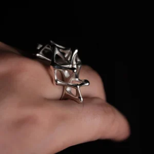 Leaping Orbit Handcrafted 999 Fine Silver Statement Ring with abstract geometric hollow design, worn on hand; a sculptural Silver Statement Ring featuring polished interconnected shapes, styled against a dark background.