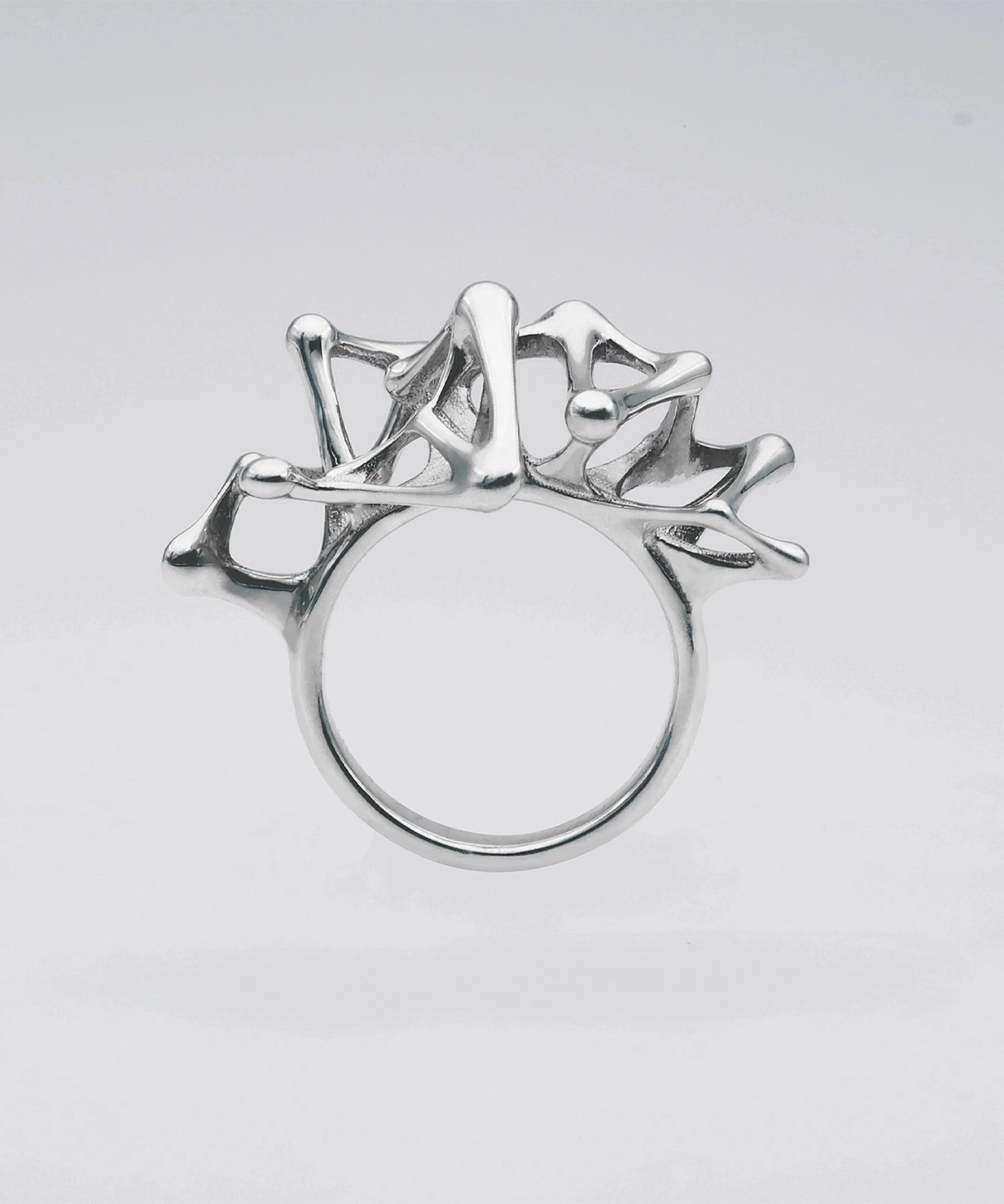 Leaping Orbit Handcrafted 999 Fine Silver Statement Ring with abstract sculptural top design; a modern Silver Statement Ring featuring interconnected organic shapes inspired by molecular and orbital forms.