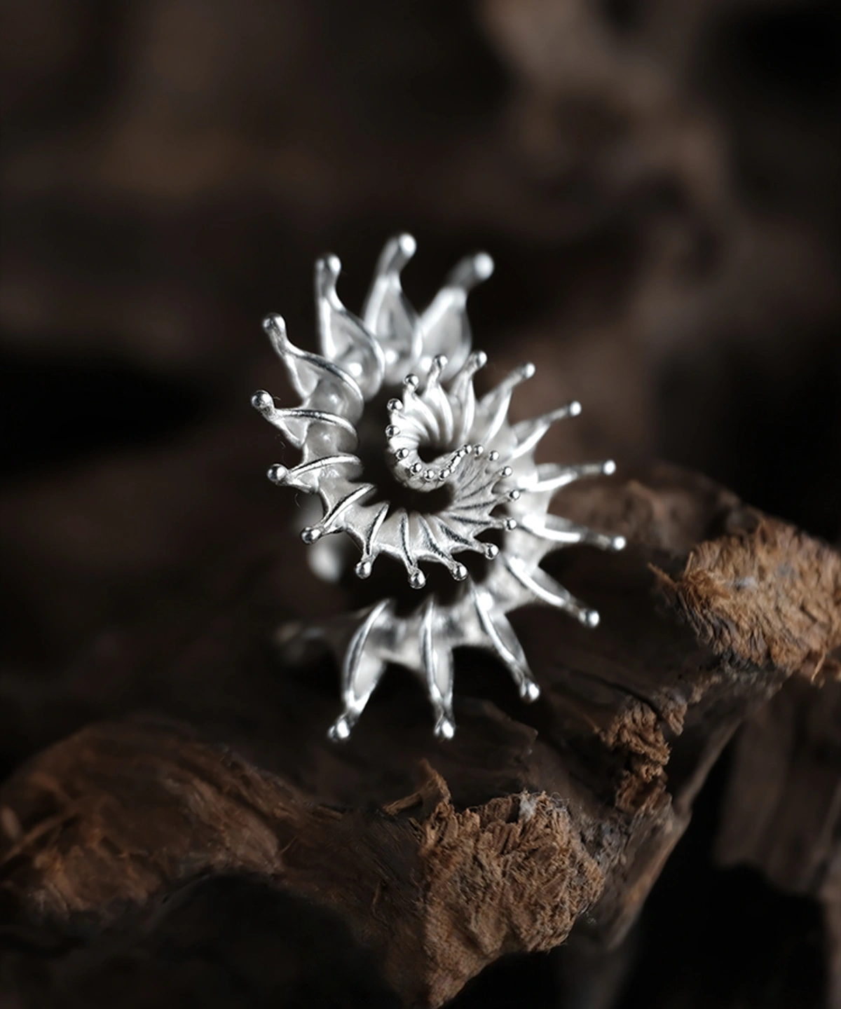 Handmade S925 sterling silver spiral ring jewelry with organic, sculptural form inspired by natural motion. Artistic silver ring featuring a bold spiral structure, statement ring design with textured silver surface.