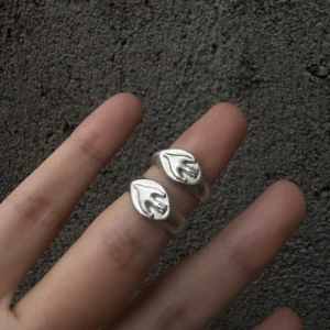 Flying Bird Ring-Handmade 999 Silver Signet Pinky Ring 05 Two silver Signet Pinky Rings with raised leaf‑like motifs worn on adjacent fingers, shown against a dark textured background.