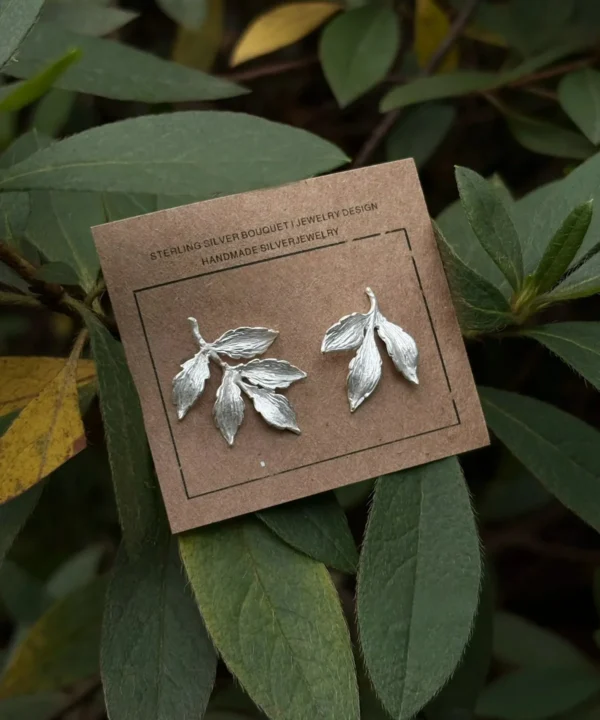 New In 18 Handcrafted textured Leaf Stud Earrings in S92 sterling silver, showcasing intricate leaf vein details and artisanal polishing.
