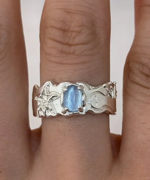 Handmade Aquamarine Ring crafted from 999 fine silver, featuring a natural aquamarine gemstone, displayed elegantly on a finger.