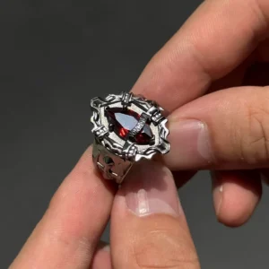 Close-up of a hand holding the handmade Vongola Ring from Katekyo Hitman Reborn! with a central red gemstone.