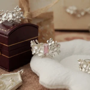 Close-up of the Unique Gemstone Ring, an orchid-inspired S925 silver ring with a central pink rectangular-cut gemstone.