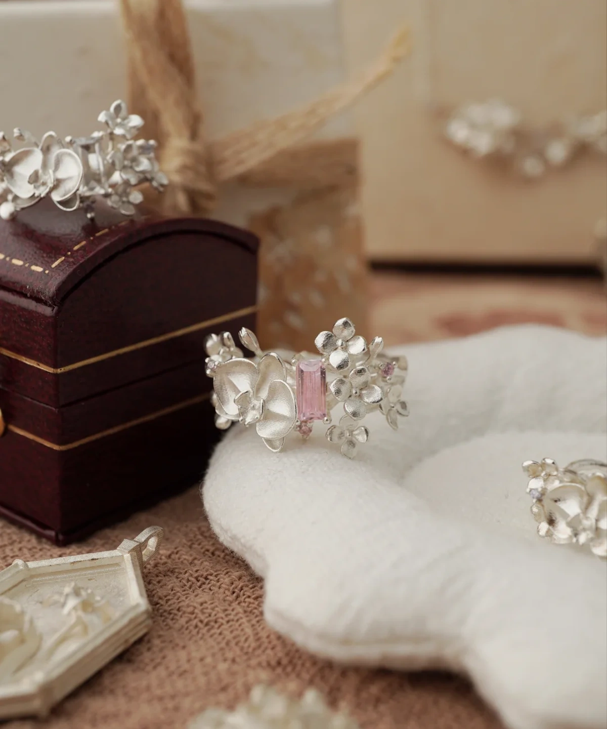 Close-up of the Unique Gemstone Ring, an orchid-inspired S925 silver ring with a central pink rectangular-cut gemstone.
