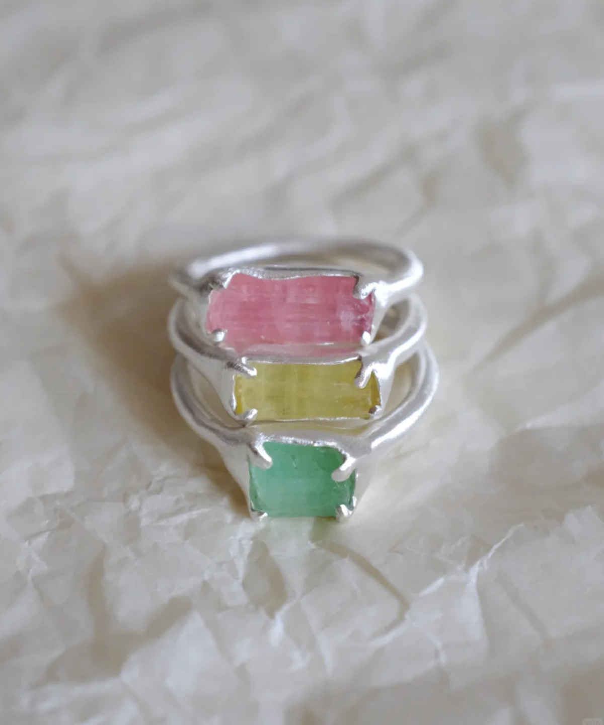 Stacked Custom Couple Rings in S925 silver, featuring natural pink, yellow, and green tourmaline gemstones in organic settings.