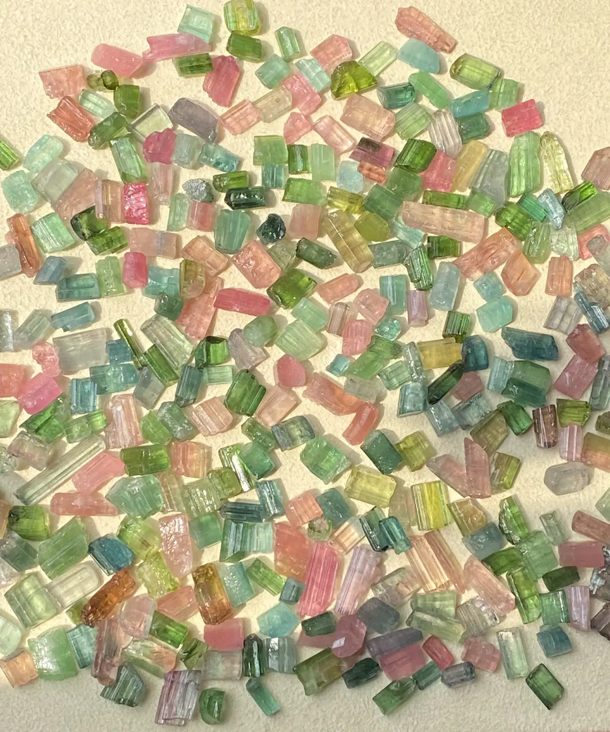 Vibrant natural multi-color tourmaline rough crystals, used in crafting Custom Couple Rings in S925 silver.