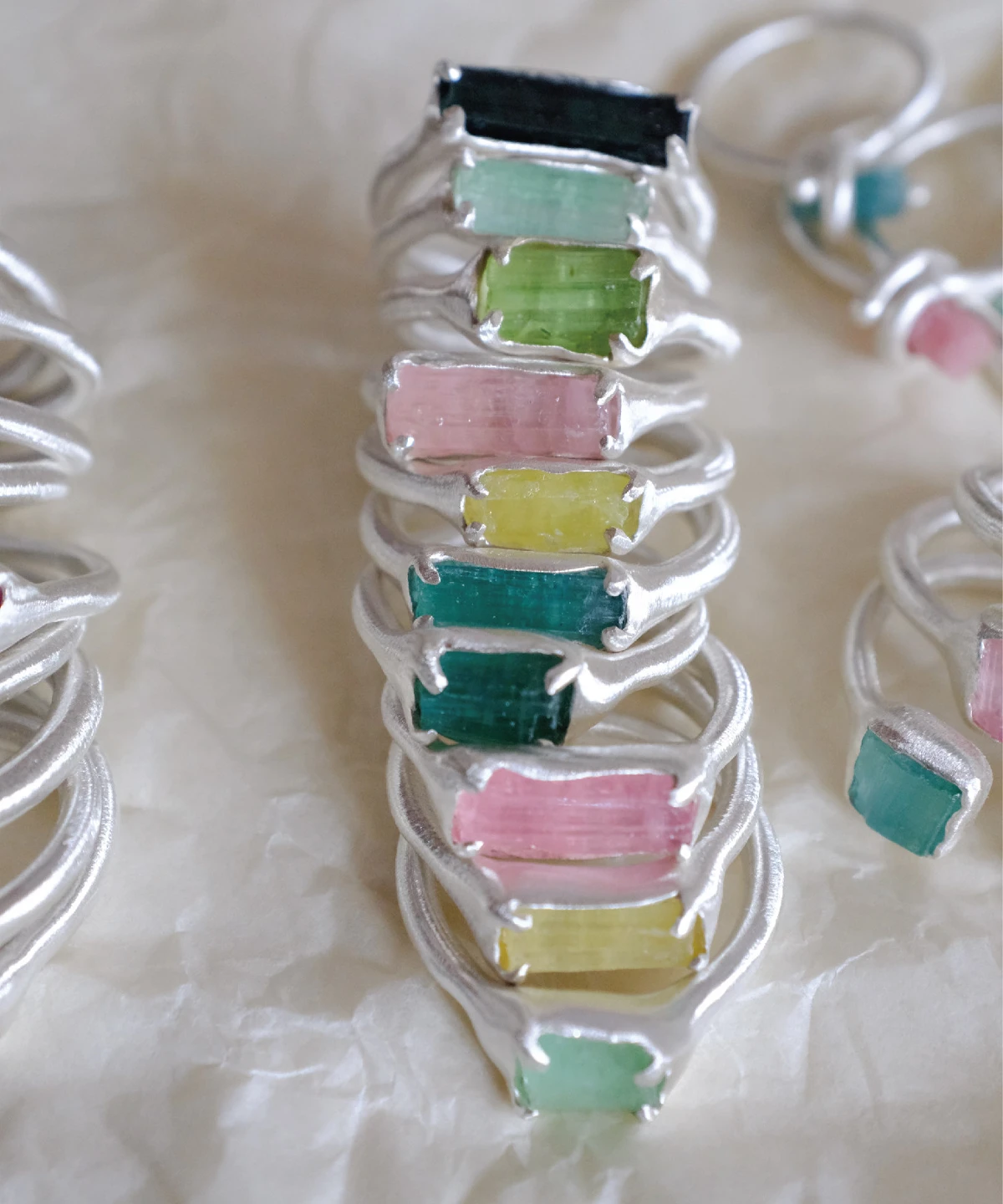 Stacked Custom Couple Rings in S925 silver, featuring raw multi-color tourmaline gemstones in organic handcrafted settings.
