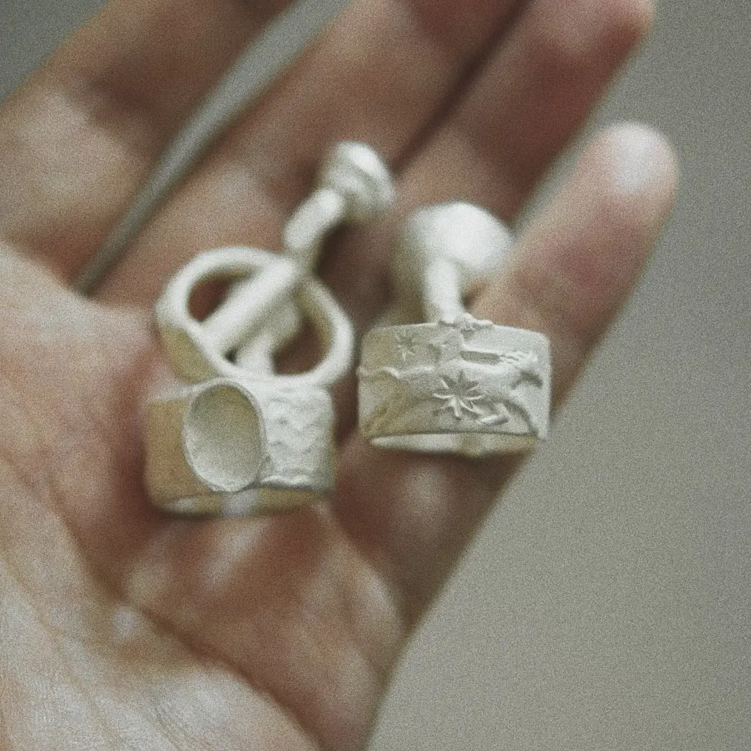 Raw 999 fine silver rings after lost-wax casting, before filing, polishing, and hand finishing.