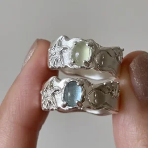 Two handcrafted 999 silver prehnite and aquamarine ring cabochons, star and moon carvings