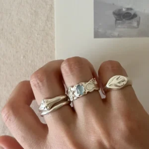 Handmade 999 silver aquamarine ring worn on hand with Lazesoul ring stack