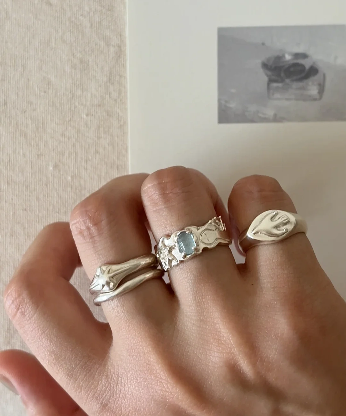 Handmade 999 silver aquamarine ring worn on hand with Lazesoul ring stack