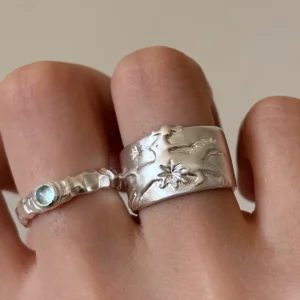 Handcrafted 999 silver cowboy horse wide band ring worn on finger with carved galloping horse and star