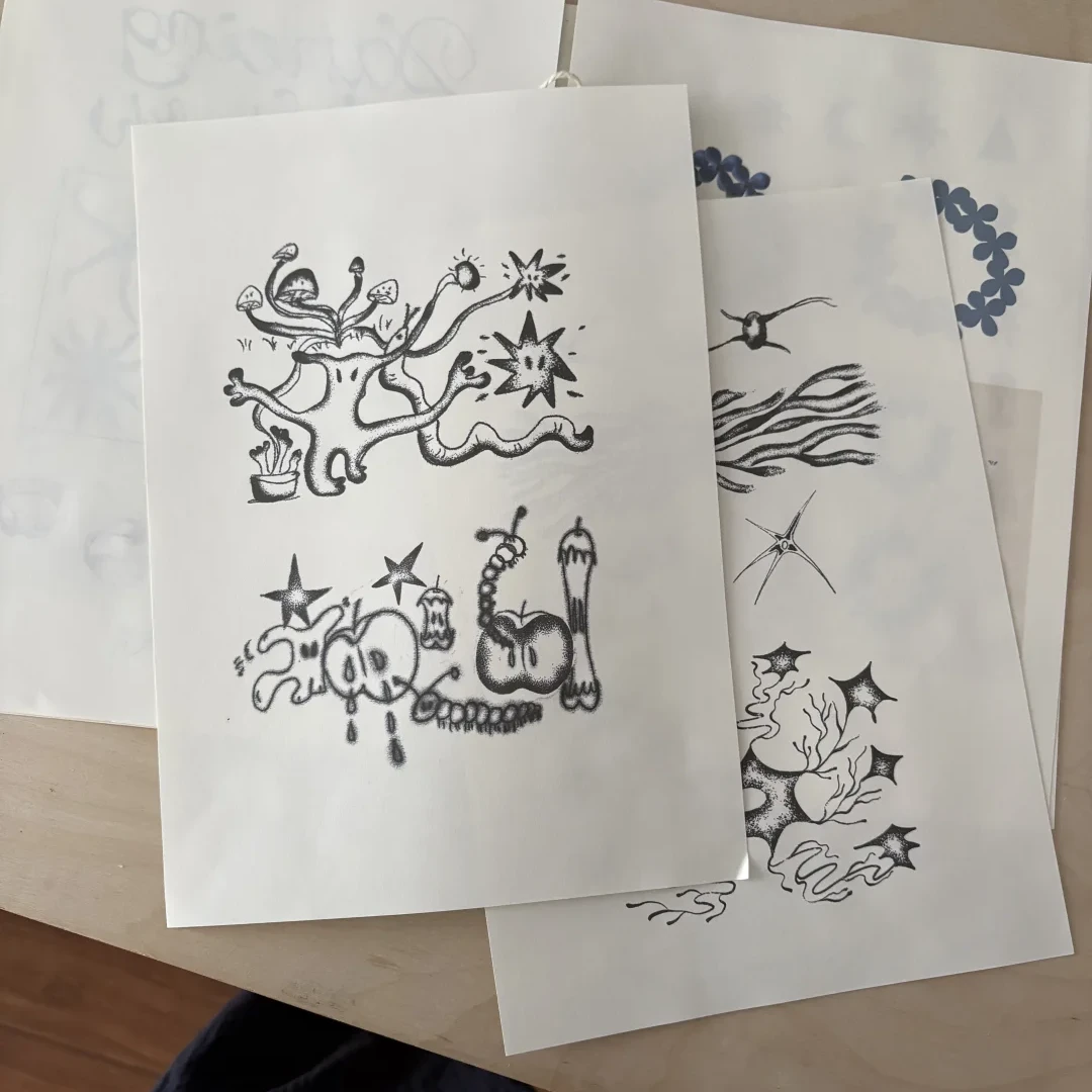 Hand-drawn design intention sketches for apple and mushroom inspired artisan rings, exploring organic shapes before jewelry making begins.