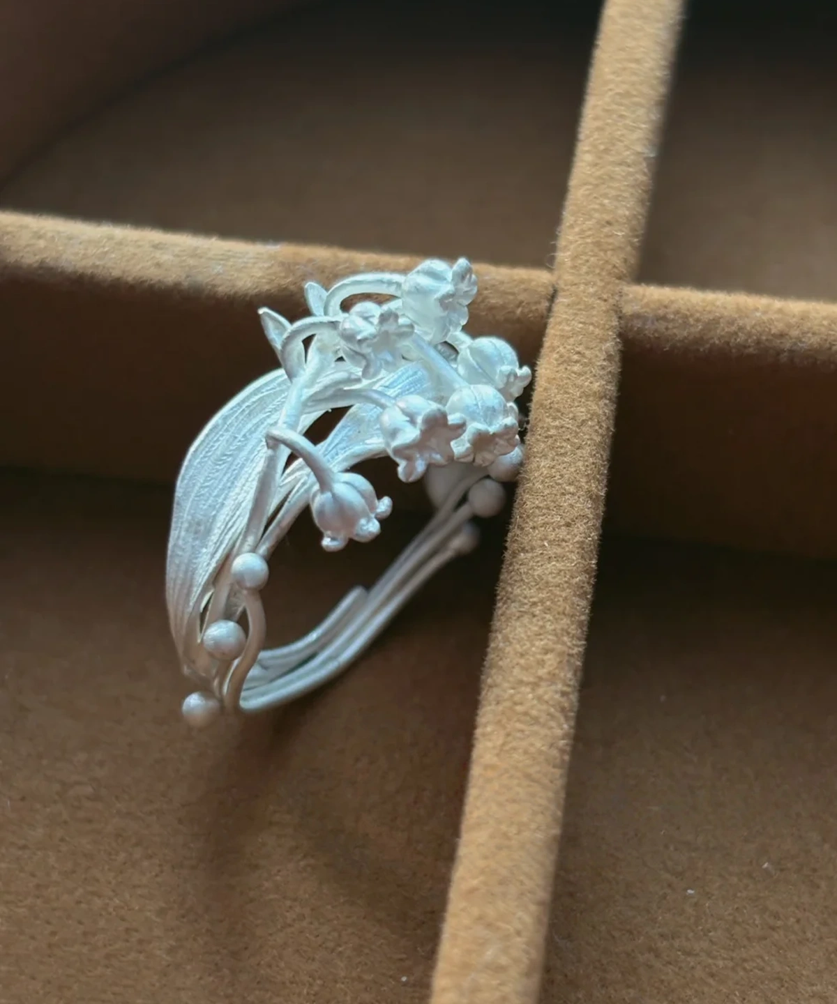 Lily of the Valley Silver Ring – Top View Detail Shot silver lily of the valley ring top view in jewelry box, handmade floral detail