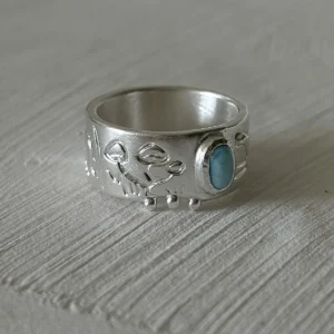 arimar silver ring on white background natural blue larimar stone fine silver wide band