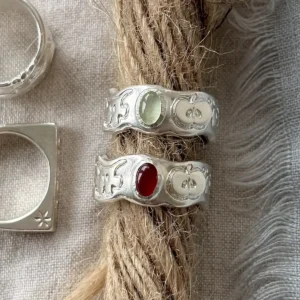 Lazesoul apple motif 999 silver rings in prehnite and carnelian flat lay on linen