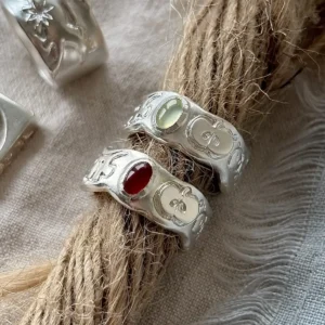 Two hand-carved 999 silver apple rings with prehnite and carnelian on jute rope
