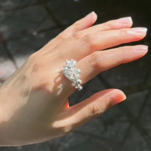 handmade sterling silver lily of the valley ring worn in sunlight, May birth flower ring